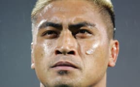 Jerry Collins listens to the national anthem during a match between the All Blacks and France in Lyon in 2006.