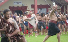 Hundreds of Māori toa, warriors, welcome officials on Owae Marae in Waitara for the commemorations of the New Zealand Land Wars.