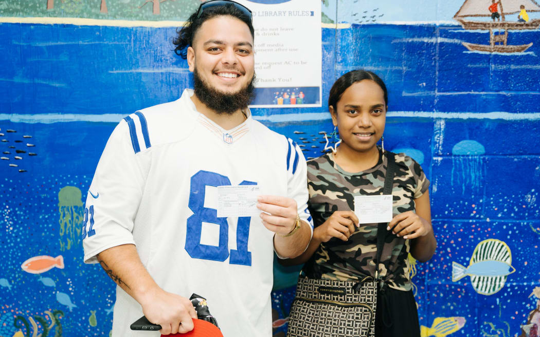 Island music stars Isaiah 'Zeah' Kramer and Rosie Delmah show off their CDC vaccine cards following receipt of their first vaccine shot in Majuro recently.