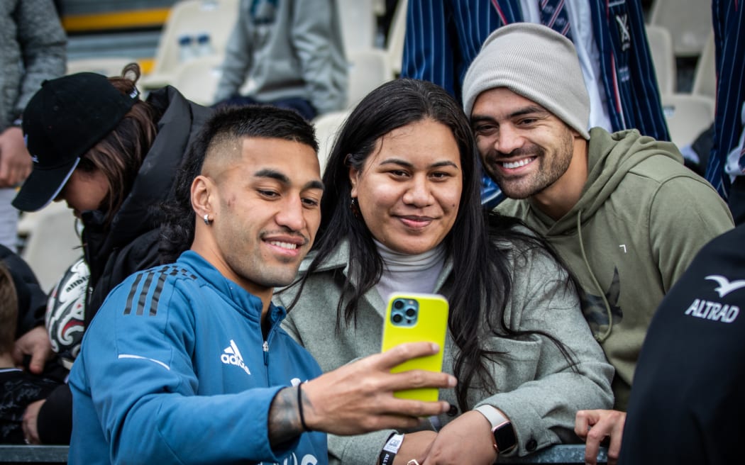 Rieko Ioane takes a selfie with Christchurch fans