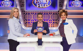 Family Feud is hosted by Dai Henwood, (centre).