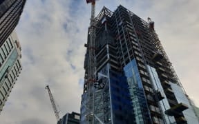Police are speaking to a man who climbed the crane in central Auckland.