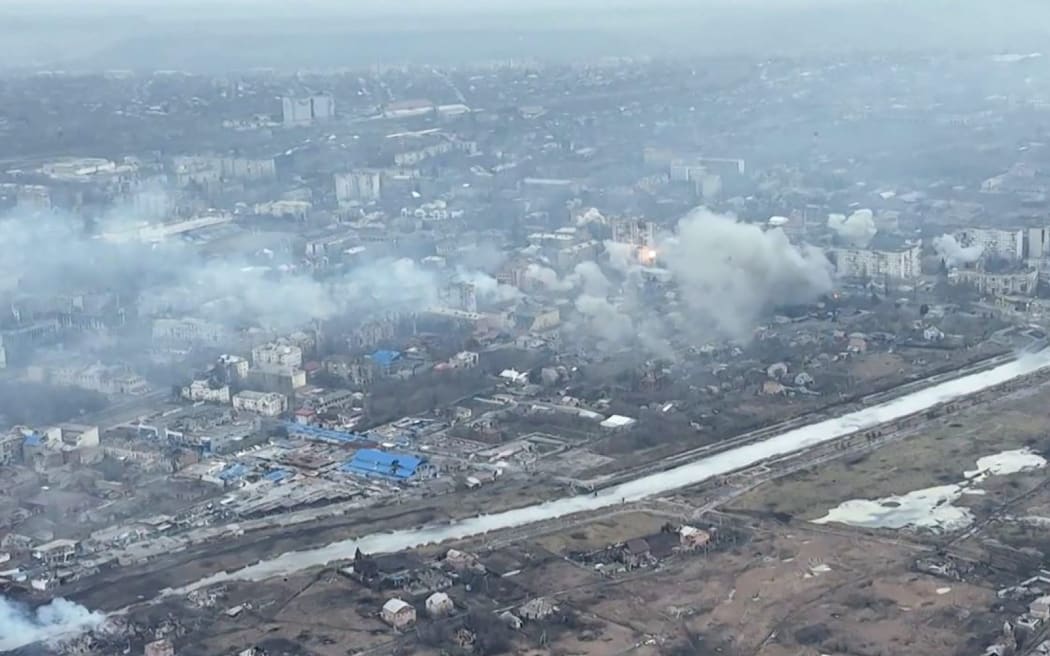 This video grab taken from a shooting by AFPTV shows an aerial view of destructions during fighting in the city of Bakhmut on 27 February 2023.