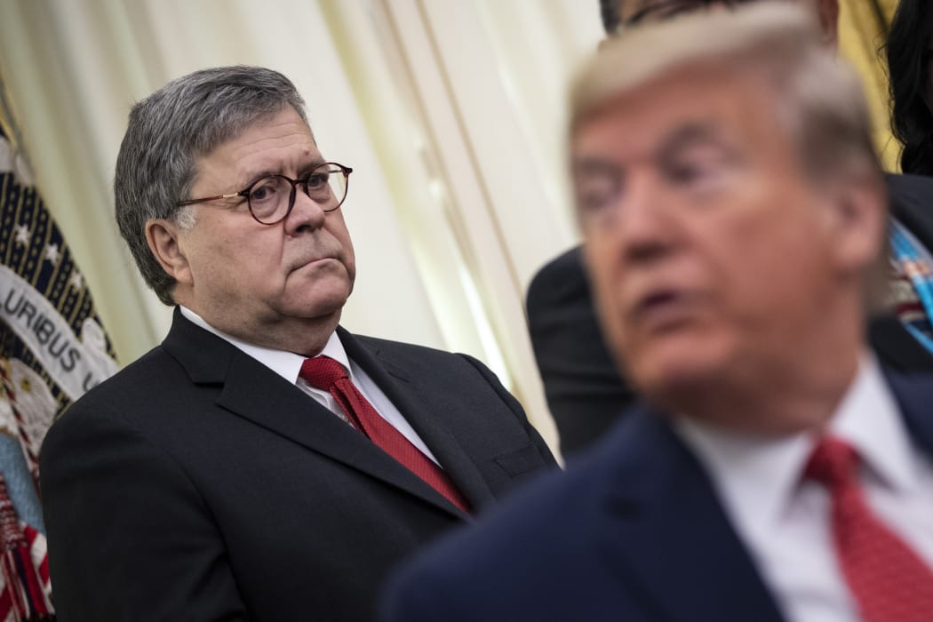 US Attorney General William Barr and US President Donald Trump in the Oval Office of the White House on 26 November 2019 in Washington, DC.