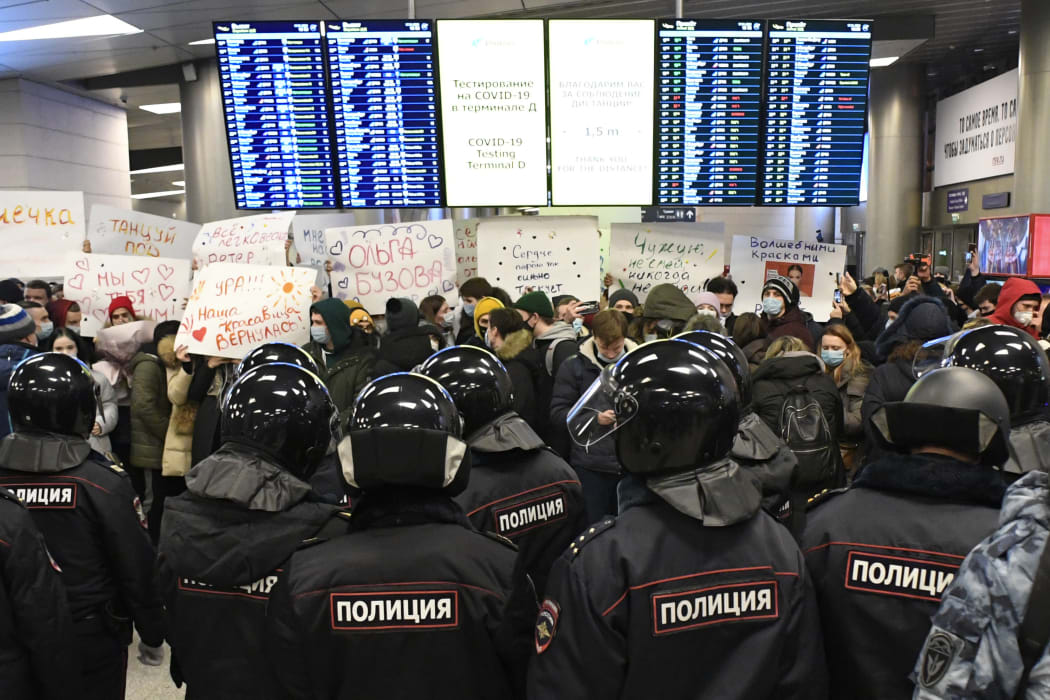 Law enforcement officers stand guard in a terminal of Moscow's Vnukovo airport where Russian opposition leader Alexei Navalny was expected to arrive on January 17, 2021.