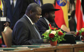 President of South Sudan Salva Kiir Mayardit (R) and opposition leader of South Sudan Riek Machar (L) attend a signing ceremony of agreement between South Sudanese government and armed oppositions on sharing power and security regulations in Khartoum, Sudan on August 05, 2018.