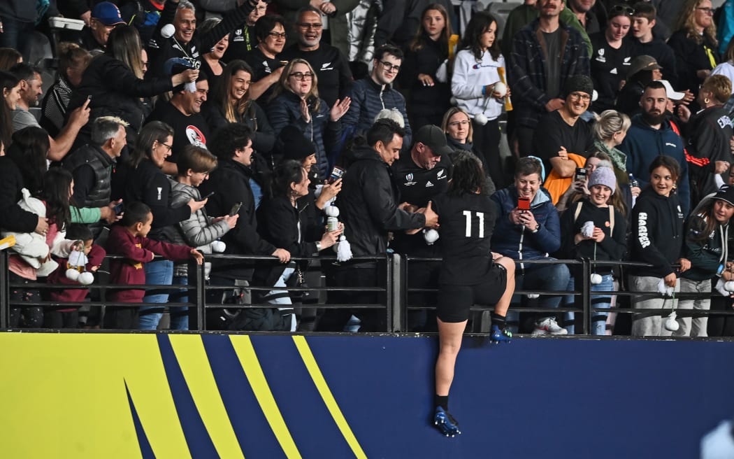 Black Ferns' Portia Woodman celebrates with fans after the match. Australia v New Zealand Black Ferns, Women’s Rugby World Cup New Zealand 2021 (played in 2022) pool match at Eden Park, Auckland, New Zealand on Saturday 8 October 2022.