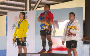 Kiribati's Ruben Katoatau finally got his first Pacific Games gold medals at Maranatha Hall on Wednesday, on a day that was otherwise dominated by Australian weightlifters. Photo: Pacific Games Media