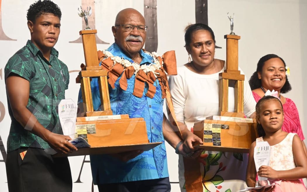Fiji's Prime Minister Sitiveni Rabuka (second from left) aims to promote Fiji as a sports center in the region.