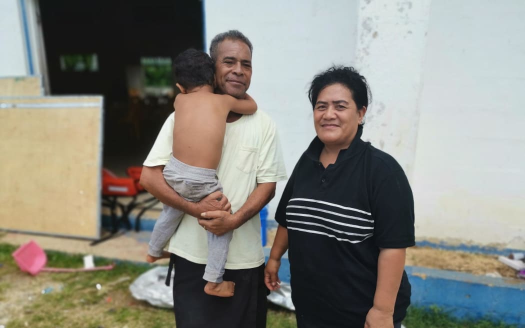 Mango town officer Sione Vailea with wife and child.