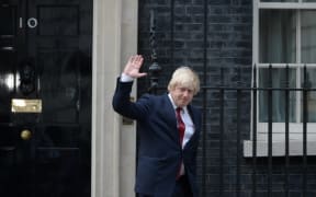 Boris Johnson waves as he leaves 10 Downing Street.