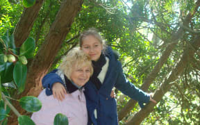 Inga Tokarenko with her grandmother in Ukraine several years ago.