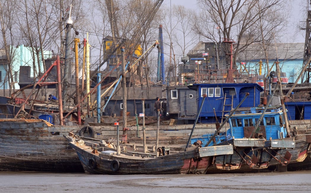 North Korean fishing vessels are docked on the banks of the Yalu River in the North Korean border town of Sinuiju on April 6, 2009 across the river from Dandong, in northeast China's Liaoning province.