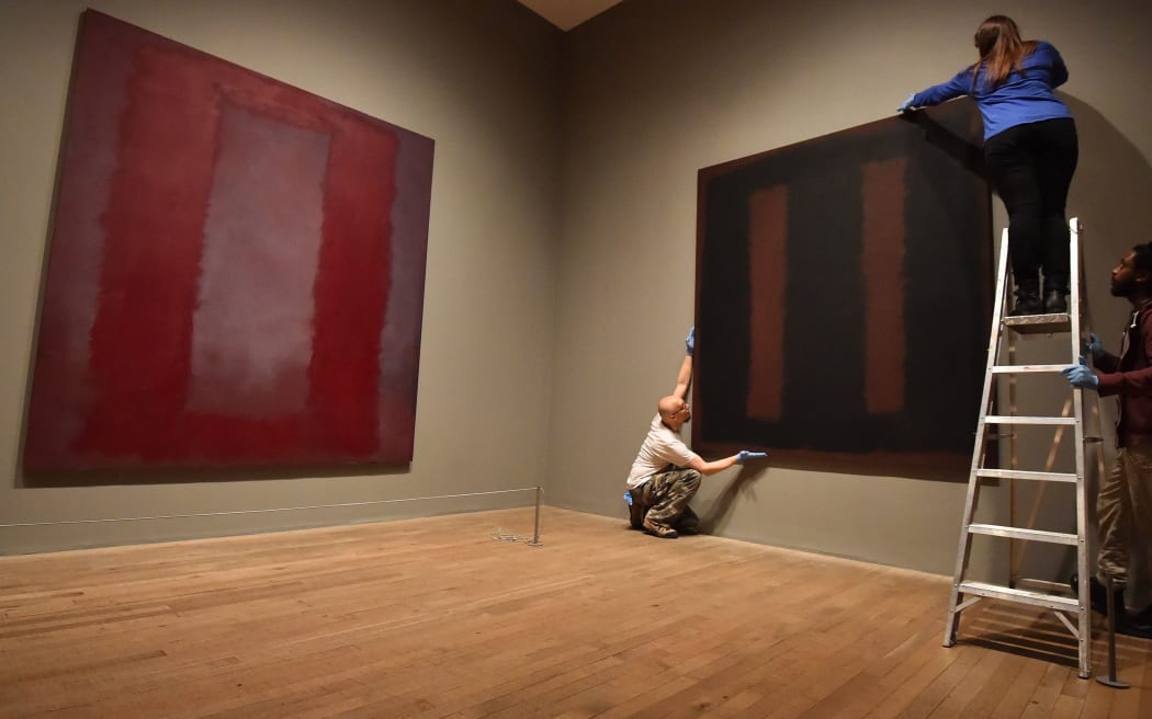 Mark Rothko's 'Black on Maroon' has gone back on display at the Tate Modern in London.