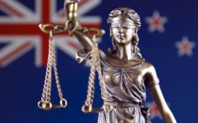 Symbol of law and justice with New Zealand Flag. Close up.
