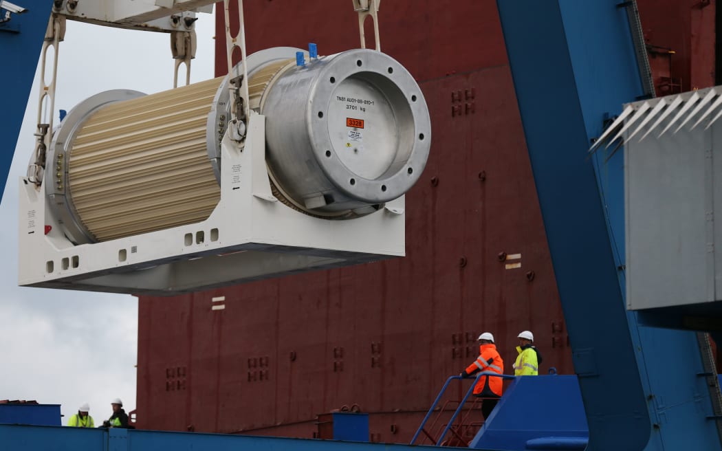 A transport storage cask for the return of high activity waste from reprocessing is loaded onto the BBC Shanghai cargo ship in Cherbourg-Octeville. The vessel is to deliver nuclear waste back to Australia after its reprocessing in France. AFP PHOTO / CHARLY TRIBALLEAU