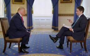Axios National Political Correspondent Jonathan Swan speaking with US President Donald Trump.