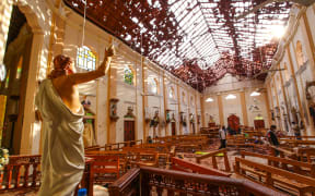 Officials inspect the damaged St. Sebastian's Church after multiple explosions targeting churches and hotels across Sri Lanka on Easter Sunday, April 21, 2019 in Negombo, north of Colombo, Sri Lanka.