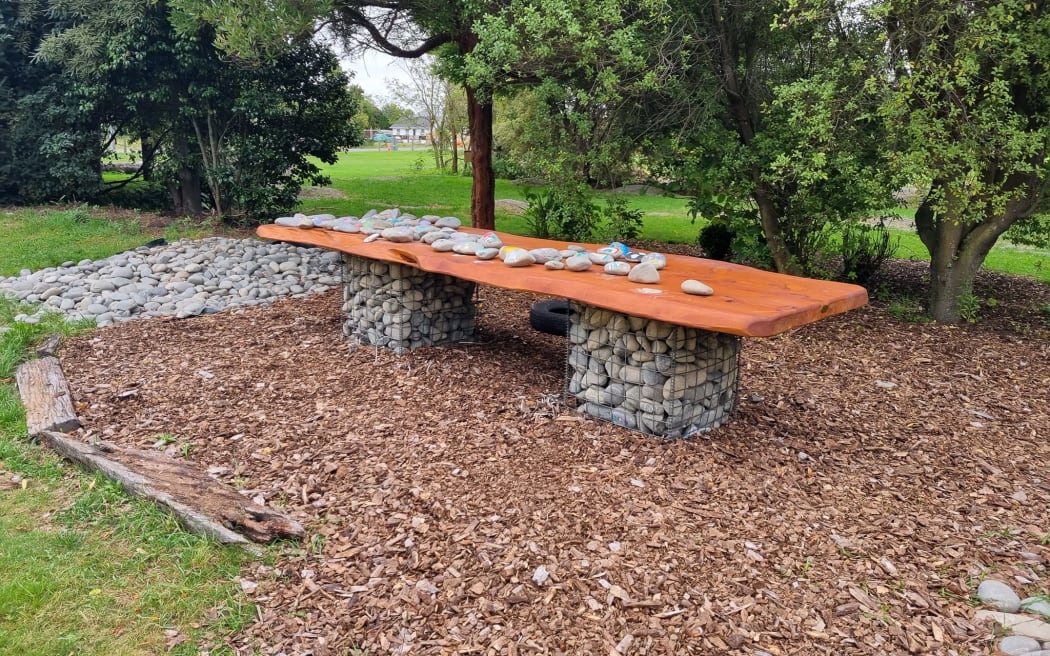 The large macrocarpa table stolen from a children's play area within the redzone.