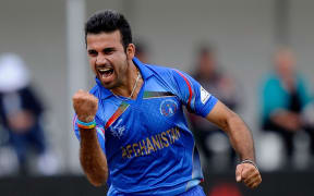 Afghanistan's Dawlat Zadran celebrates his wicket of Sri Lanka's Lahiru Thrimanne.