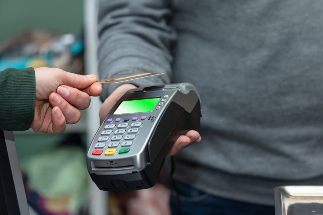 NFC technology, customer do payment with contactless credit card. Credit card reader implements payment execution, in the shop