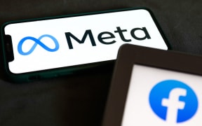 Meta logo displayed on a phone screen and Facebook icon displayed on a laptop screen are seen in this illustration photo taken in Krakow, Poland on October 29, 2021.