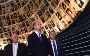 Britain's Prince William, Chief Rabbi Ephraim Mirvis of the United Congregations of the Commonwealth (L) and chairman of Yad Vashem Avner Shalev, tour the Yad Vashem Holocaust memorial in Jerusalem on 26 June, 2018.