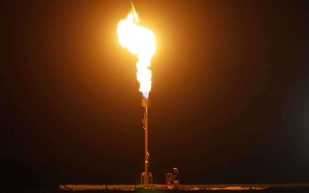 Gas flares during fracking, or hydraulic fracturing. During the process fluid containing sand and chemicals is injected at high pressure to fracture rock to get at oil and gas from the earth's crust.