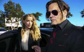 Johnny Depp and Amber Heard arrive at a court on the Gold Coast.