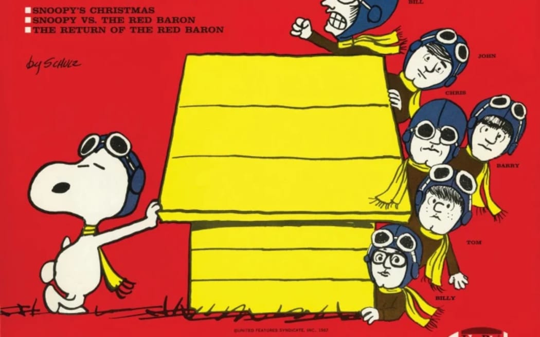 The cover of the 1967 album 'Snoopy & His Friends' by The Royal Guardsmen. A cartoon dog wearing an aviator's helmet casually leans against one end of a kennel, while similarly-dressed members of the band peek around the other end.