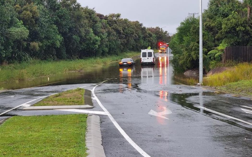 Molesworth Drive in Mangawhai was closed after a car got stuck in downpour.