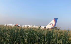 In this handout video grab released by Russian Investigative Committee, the Airbus A321, which made a hard landing in a corn field near Zhukovsky International Airport, is pictured in Moscow region, Russia.