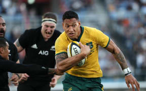 The Wallabies back Israel Folau in action against the All Blacks.