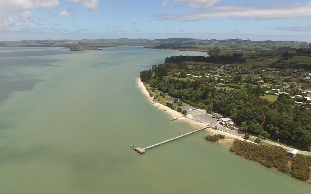 Kaipara Harbour looking back towards Parakai with Shelly Beach wharf in the foreground.  South Head, New Zealand