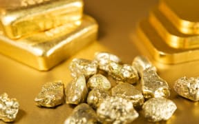 A collection of gold bars, ingots and nuggets (file)