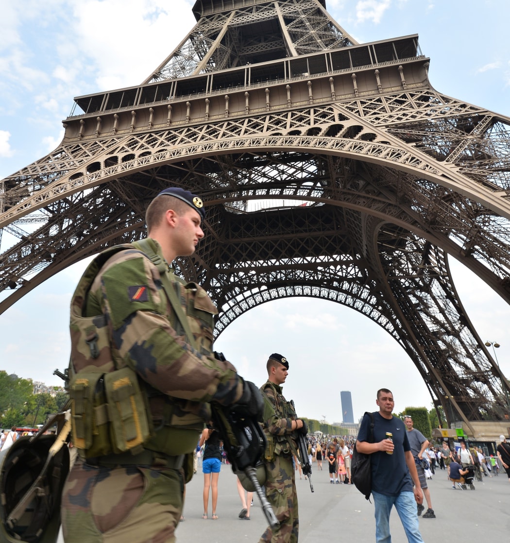 France is already under a state of emergency. Here, soldiers patrol the Eiffel Tower, in Paris.