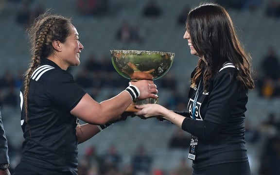 New Zealand's captain Fiao'o Faamausili is presented the Laurie O'Reilly Cup by Prime Minister of New Zealand Jacinda Ardern during the Black Ferns vs Australia Women's rugby match at Eden Park.