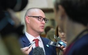 Minister of Health David Clark talking with journalists