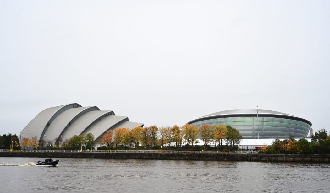 A police boat patrols on the River Clyde past the COP26 venue in Glasgow on October 31, 2021 ahead of the start of the climate summit