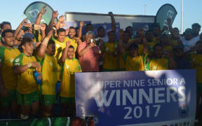 The Eels celebrate winning the inaugural Super 9 rugby title in Samoa, alongside Prime Minister Tuilaepa Sailele Malielegaoi.
