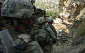 US soldiers patrol early in Korengal valley in Afghanistan's Kunar province in 2009.