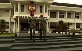 Indonesian military enter the Sarwo Edhie Wibowo centre in Jakarta.