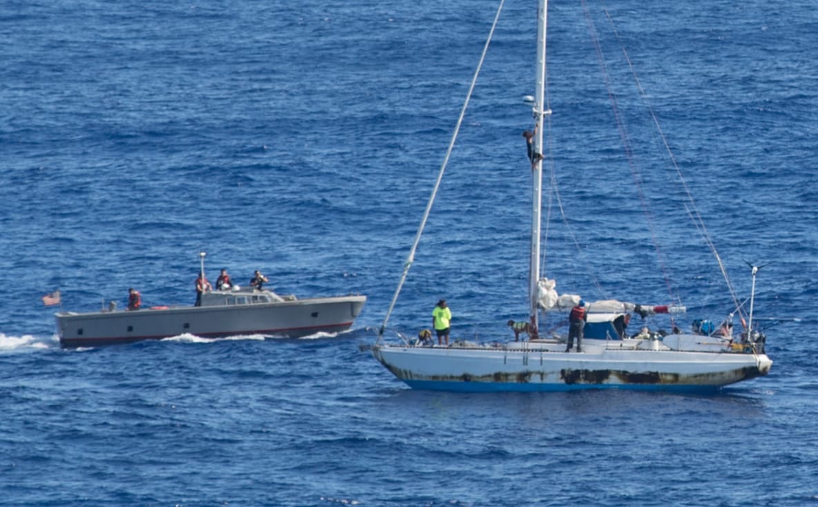 The women and their dogs were rescued after a fishing boat alerted the US authorities.