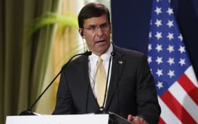 (FILES) In this file photo taken on September 07, 2019 US Secretary of Defense Mark Esper (L) holds a press conference
