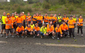 Students from the Massey High School Building Academy, who built state houses as part of a partnership with Kāinga Ora.