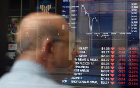 man monitors trading at a stock exchange in Sydney on June 24, 2016.