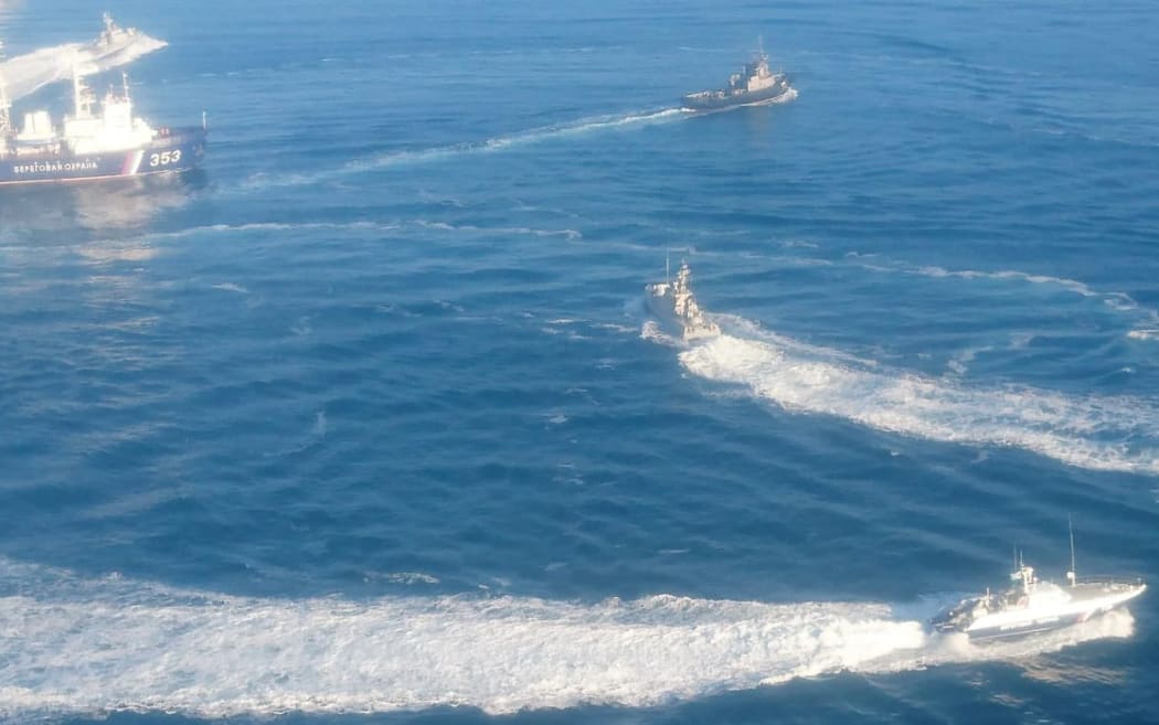 In this handout photo distributed by the Russian Federal Security Service, three Ukrainian naval ships cross the Russian border, entering temporarily closed area of the Russian territorial waters and heading from the Black Sea to the Kerch Strait in Russia, November 25, 2018.