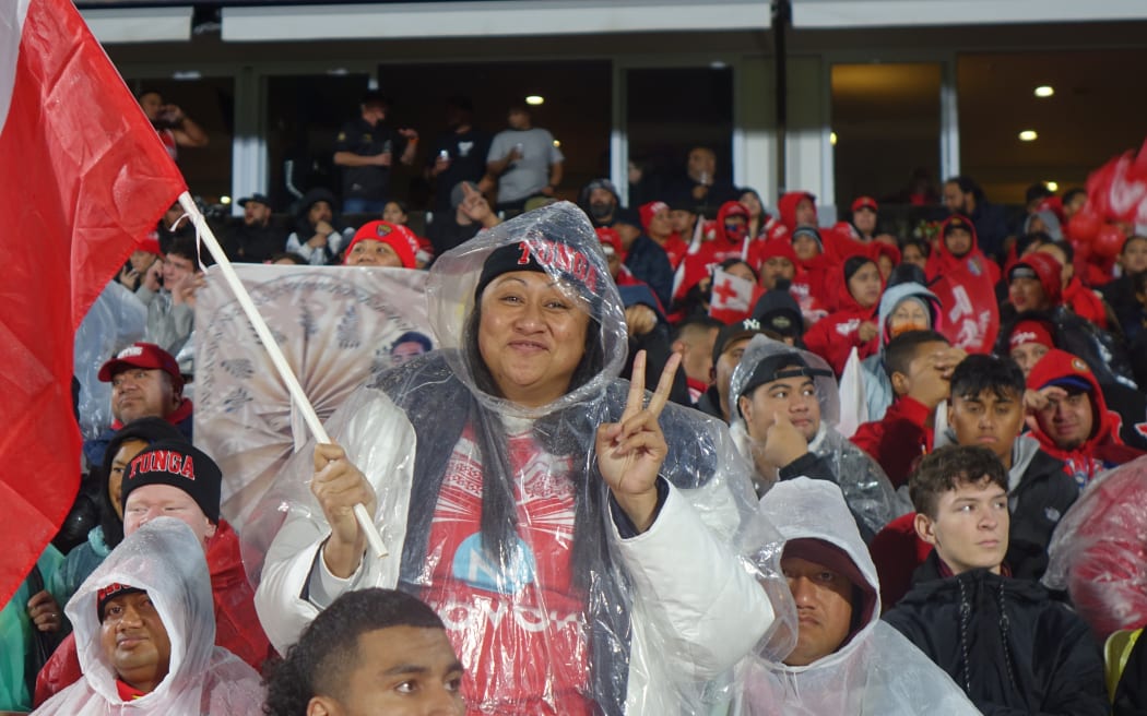 Despite some rain, Tonga fans kept up the cheer during halftime.