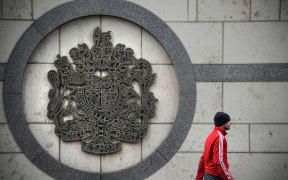 A man walks outside the British embassy building in Moscow