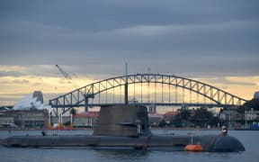 In this photo taken on October 12, 2016, a Royal Australian Navy diesel and electric-powered Collins Class submarine sits in Sydney Harbour. -